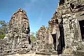 Angkor Thom - Bayon temple, second enclosure, corner towers seen from the central terrace 